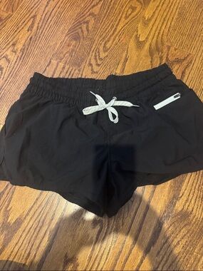 Vuori Black Athletic Drawstring Shorts with White Zip Accent